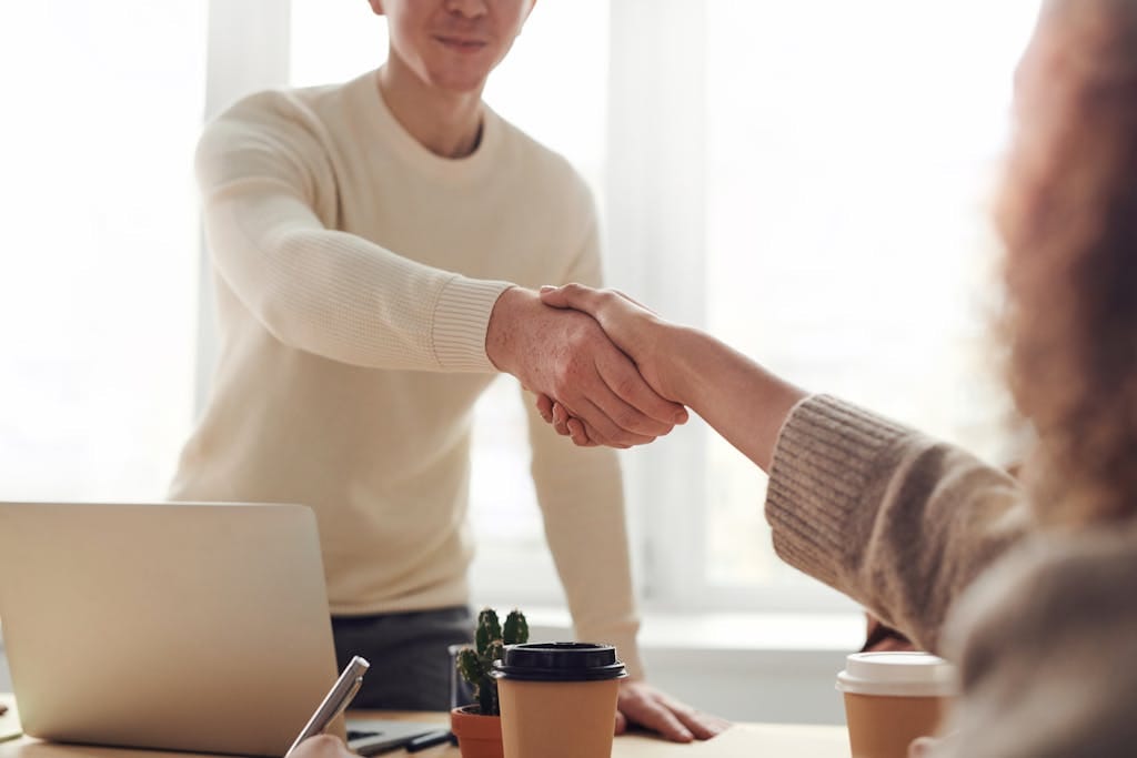 Close-up of professionals shaking hands over Medicare Planning